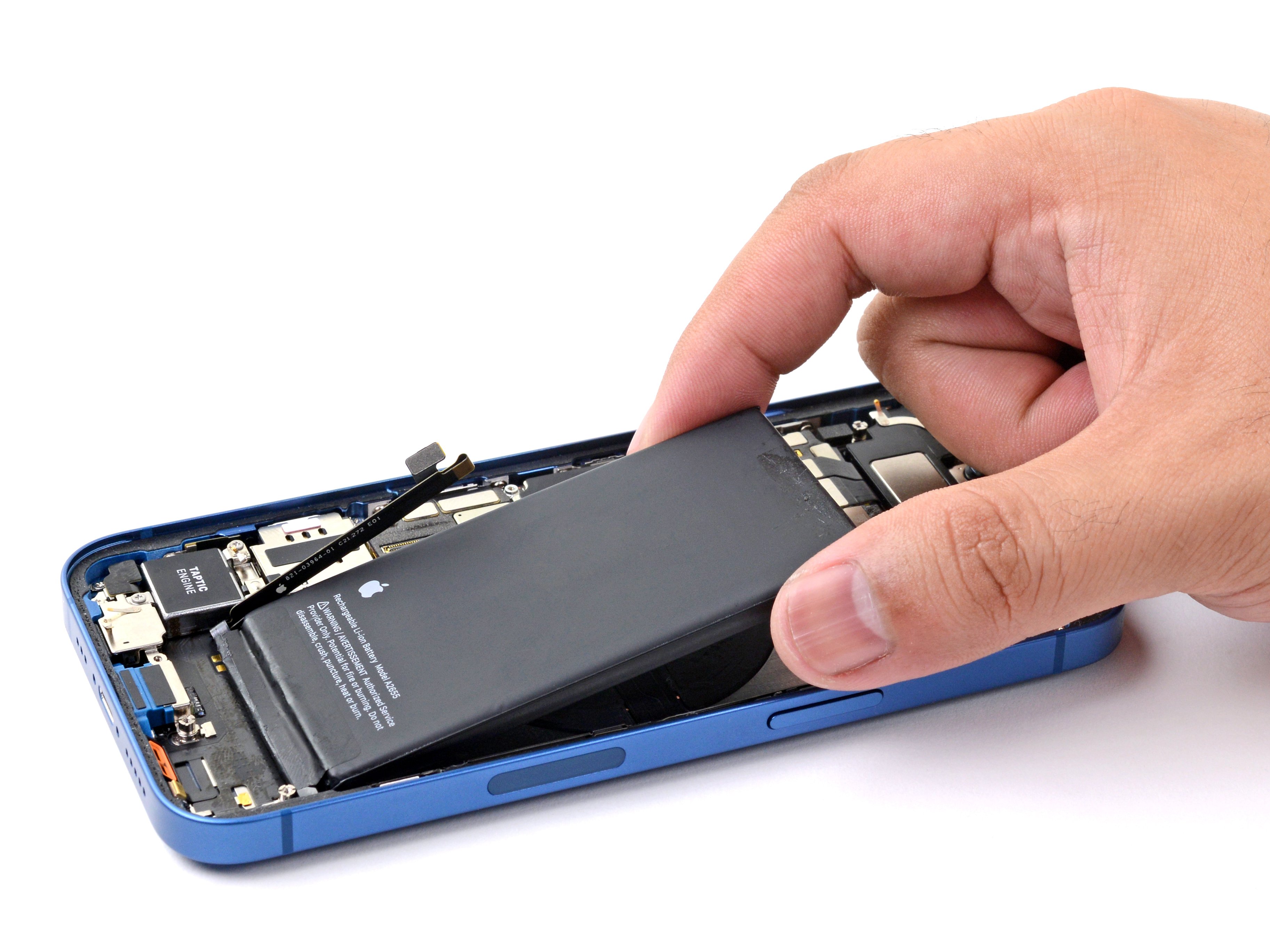 Hands replacing a battery inside an open smartphone